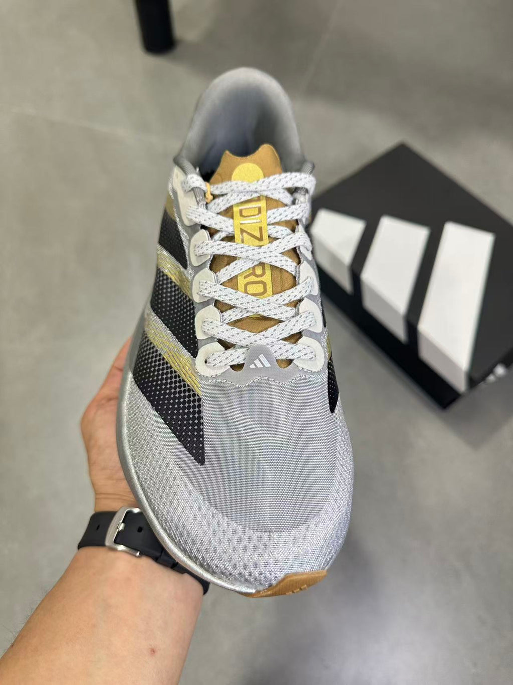Adidas Adizero Evo SL Running Shoes in Silver Black KK4310 - product image from the listing.