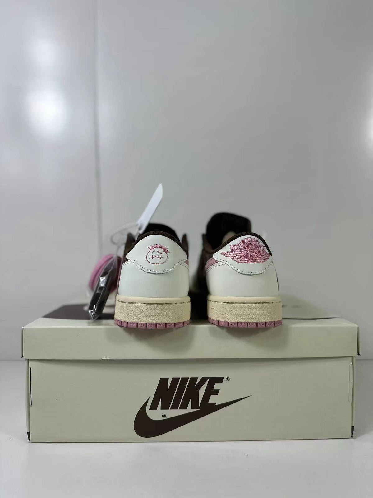 Jordan 1 Low Travis Scott in Brown White Pink DZ4137-206 - product image from the listing.