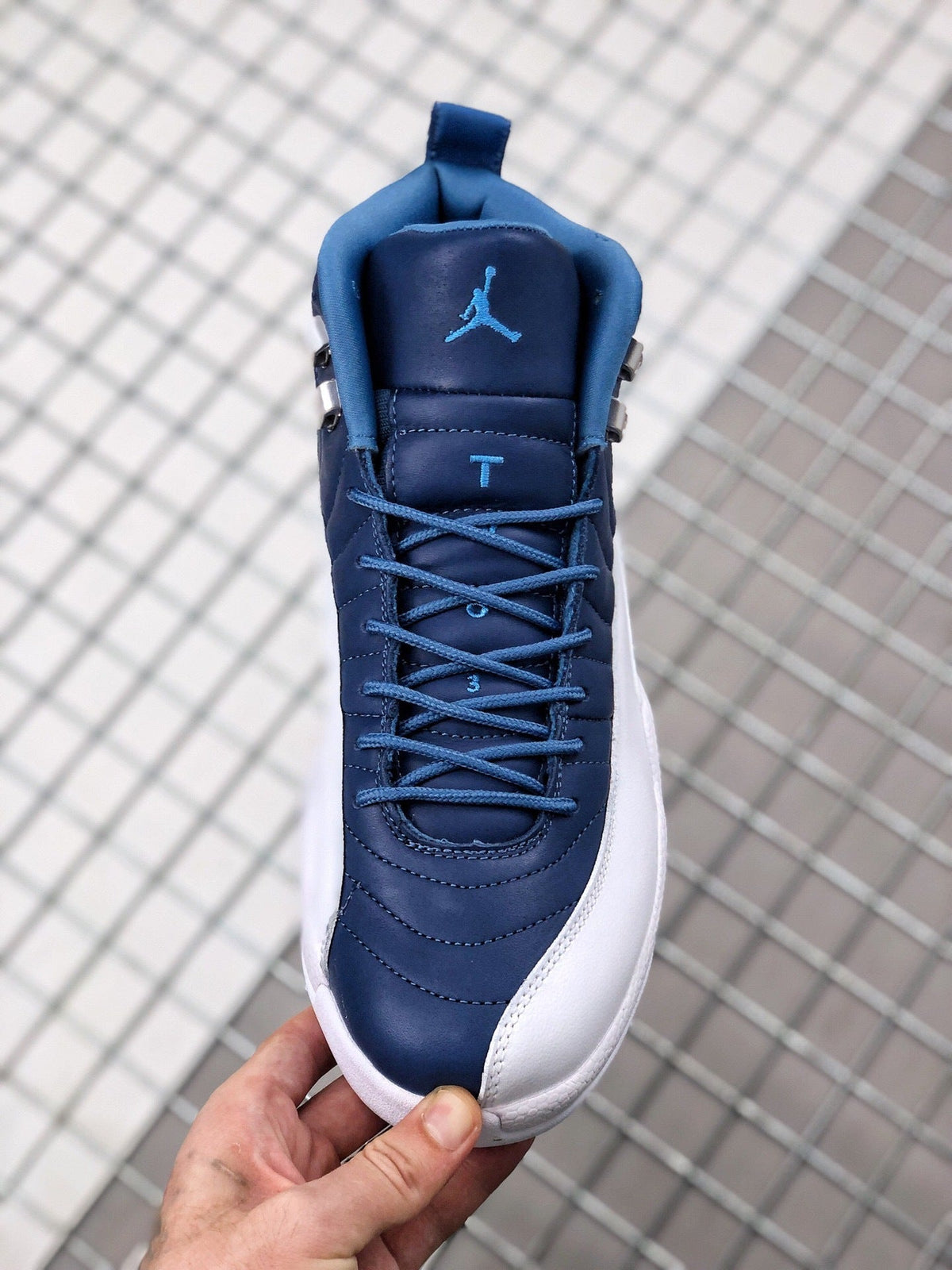 Air Jordan 12 Indigo Sneakers 130690-404 - product image from the listing.