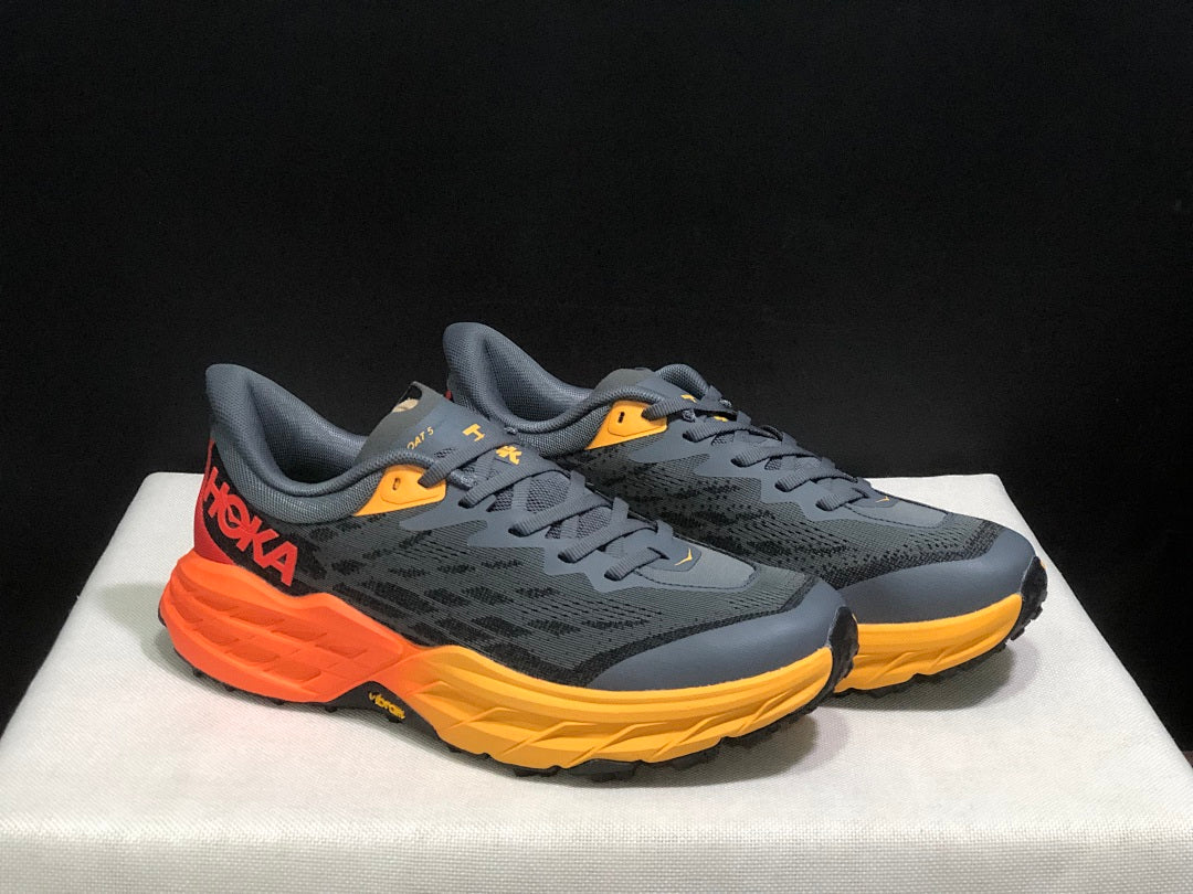 HOKA Speedgoat 5 Trail Running Shoes, in Gray and Orange - product image from the listing.