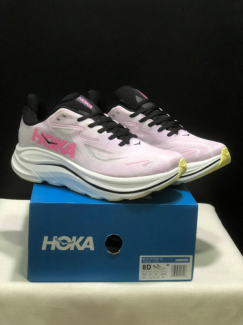 Pink and White HOKA Clifton 10 Running Shoes - product image from the listing.