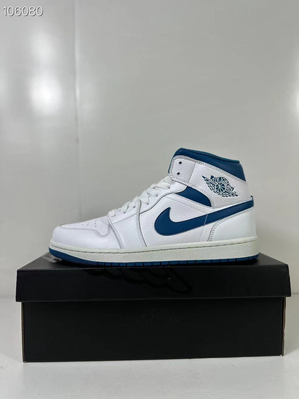 Air Jordan 1 Mid White Blue FN5215-141 Sneakers - product image from the listing.