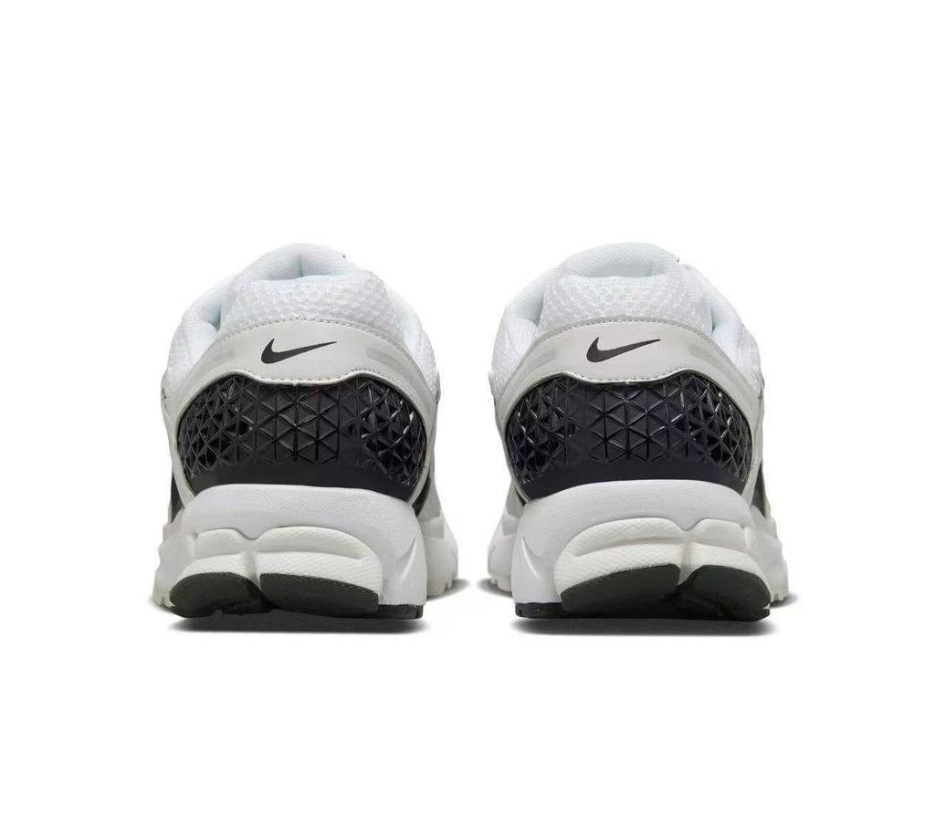 Nike Zoom Vomero 5 Sneakers in White and Black - product image from the listing.