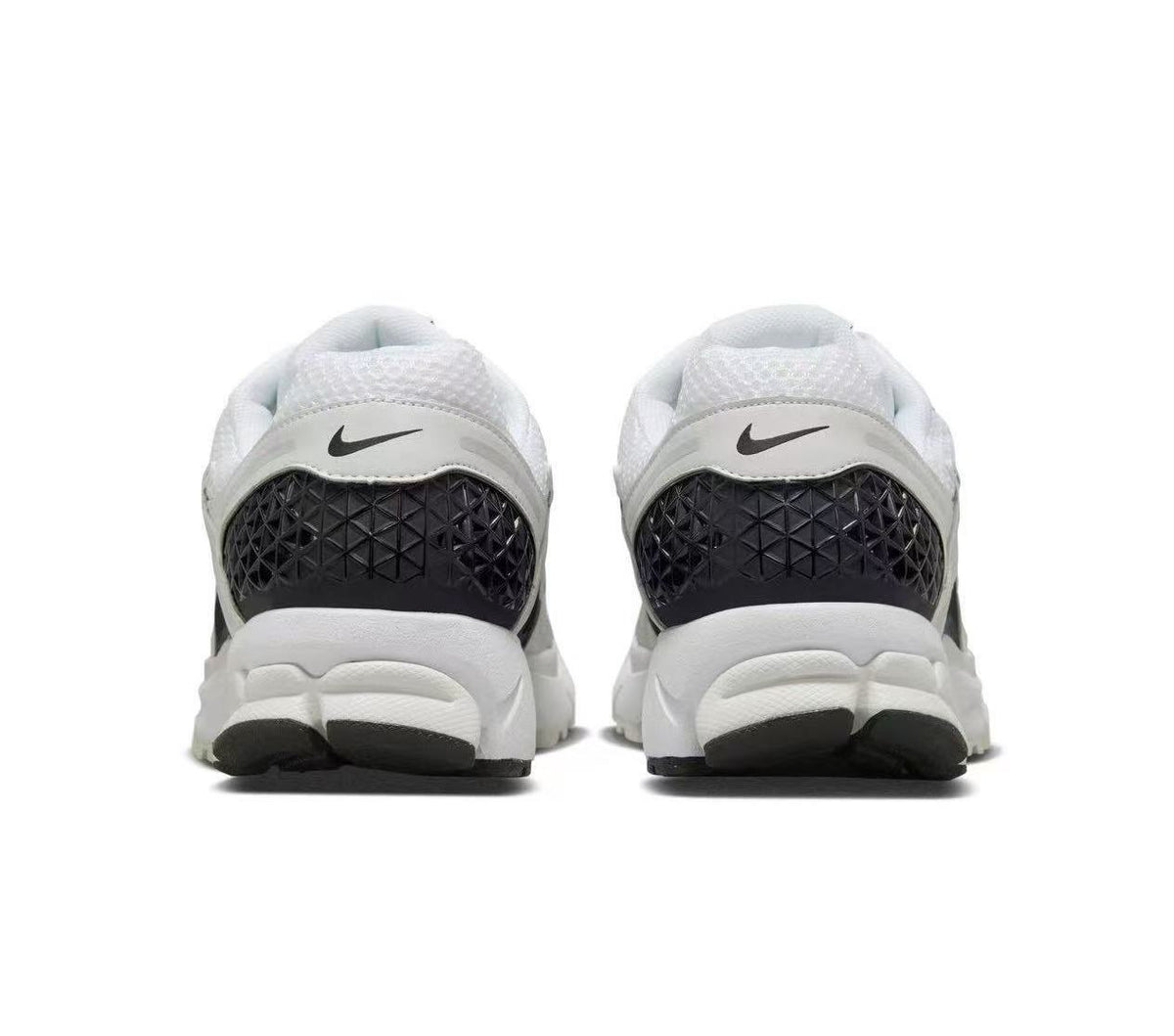 Nike Zoom Vomero 5 Sneakers in White and Black - product image from the listing.