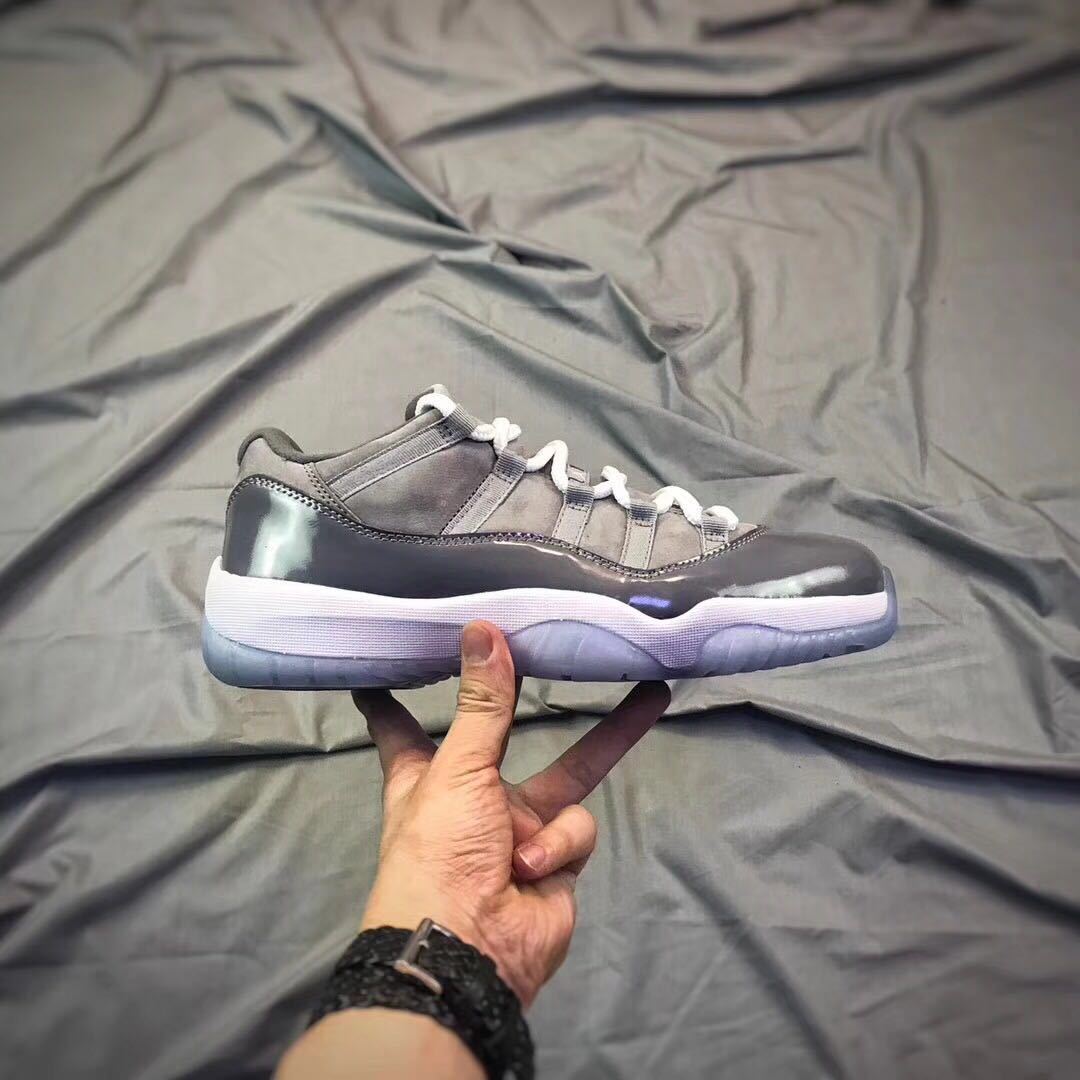 Air Jordan 11 Low Sneakers in Cool Grey - product image from the listing.