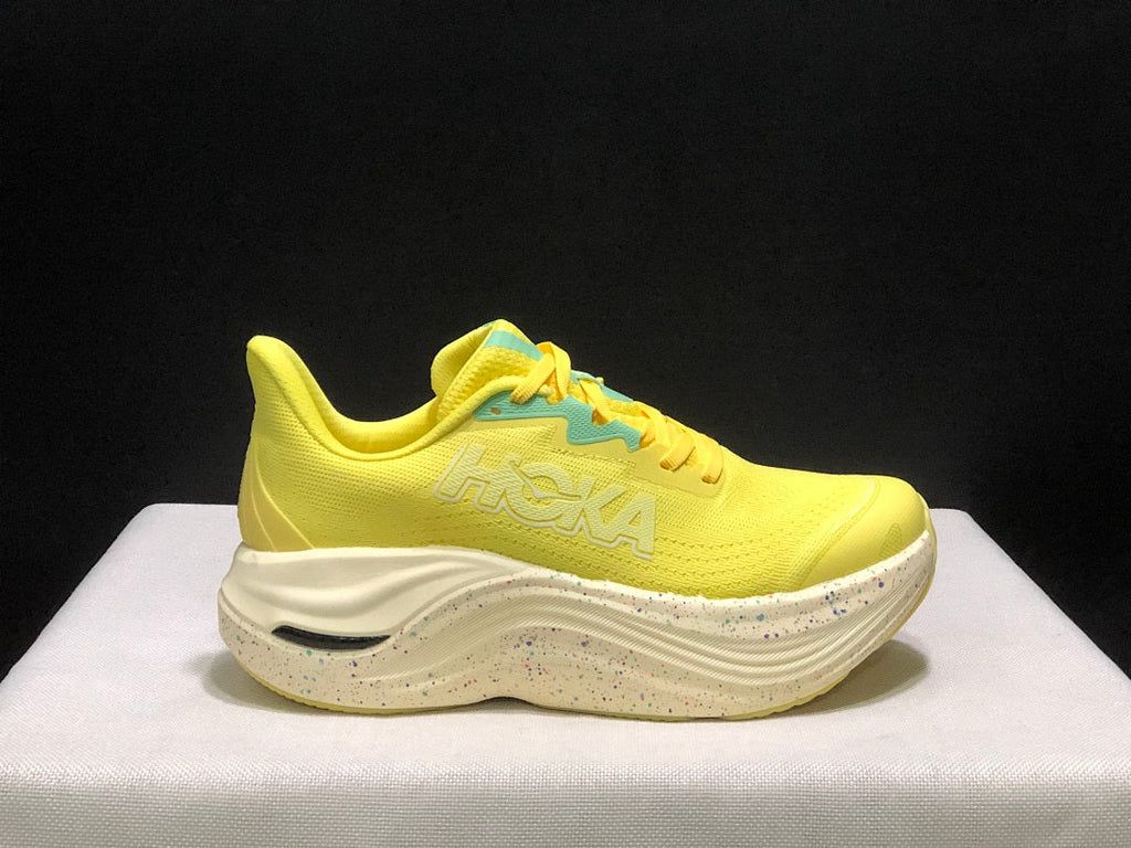 Yellow and Aqua HOKA Skyward X Running Shoes - product image from the listing.