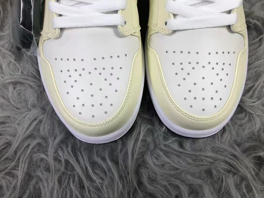 Jordan Air 1 Mid Sneakers in Cream White and Black - product image from the listing.