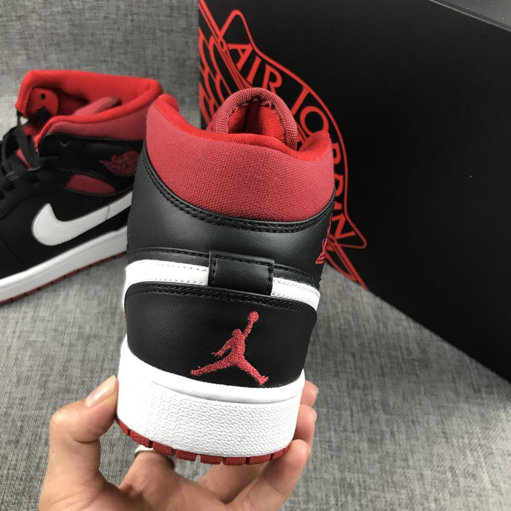 Black Red Canvas-Style Sneakers - Jordan 1 Mid 554724-020 - product image from the listing.