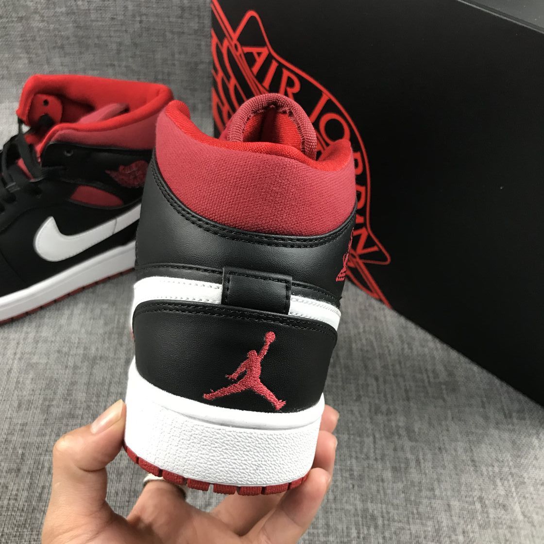 Black Red Canvas-Style Sneakers - Jordan 1 Mid 554724-020 - product image from the listing.
