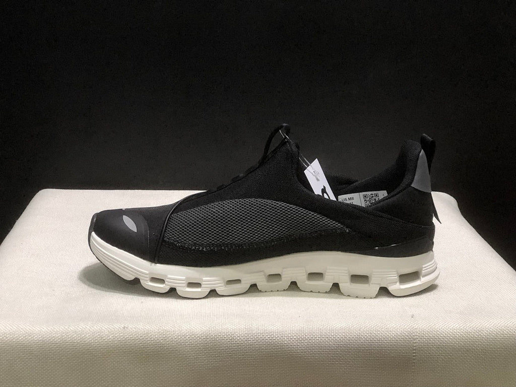 On Cloud X 4 Coast Sneakers in Black and White - product image from the listing.