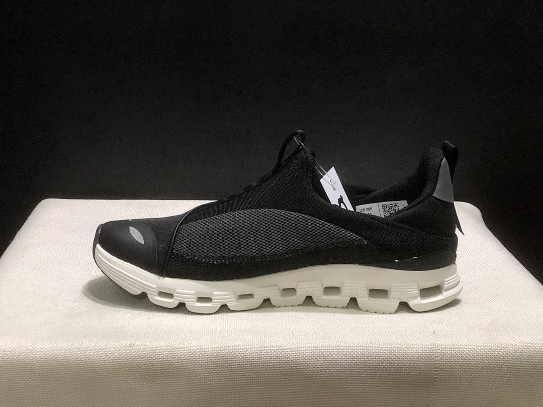 On Cloud X 4 Coast Sneakers in Black and White - product image from the listing.