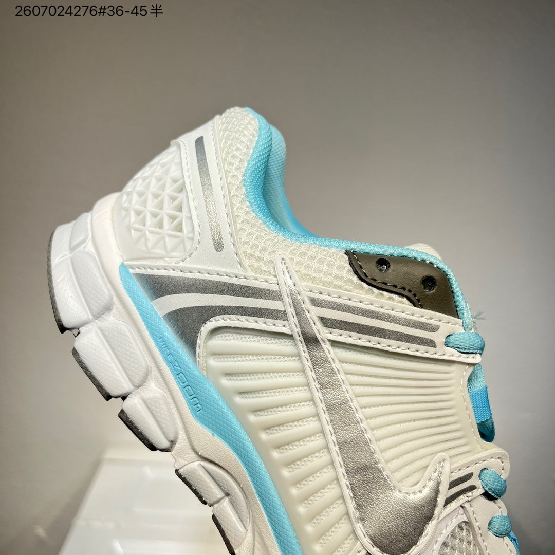 Nike Air Zoom Vomero 5 Sneakers in White and Blue - product image from the listing.