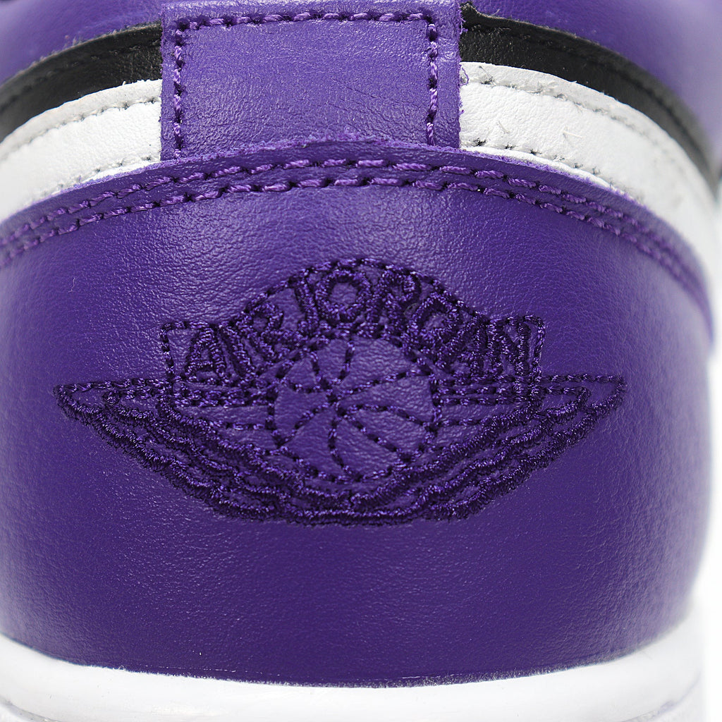 Jordan 1 Low Sneakers in Black Purple White 553560-501 - product image from the listing.