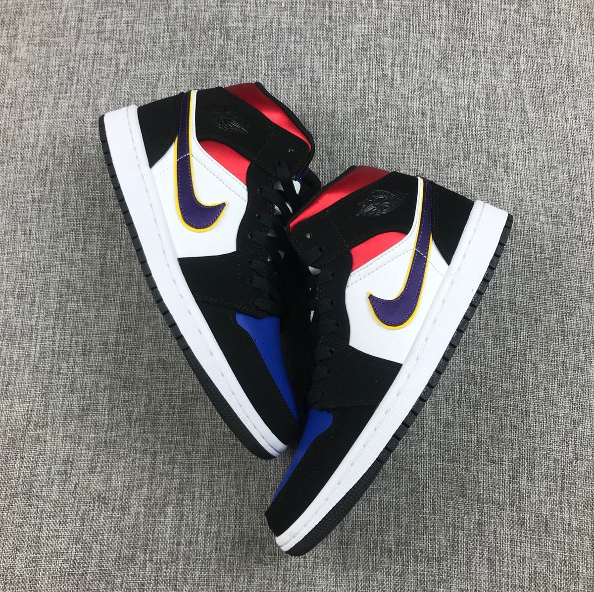 Air Jordan 1 Mid SE Sneakers in Black Purple Yellow 852542-005 - product image from the listing.