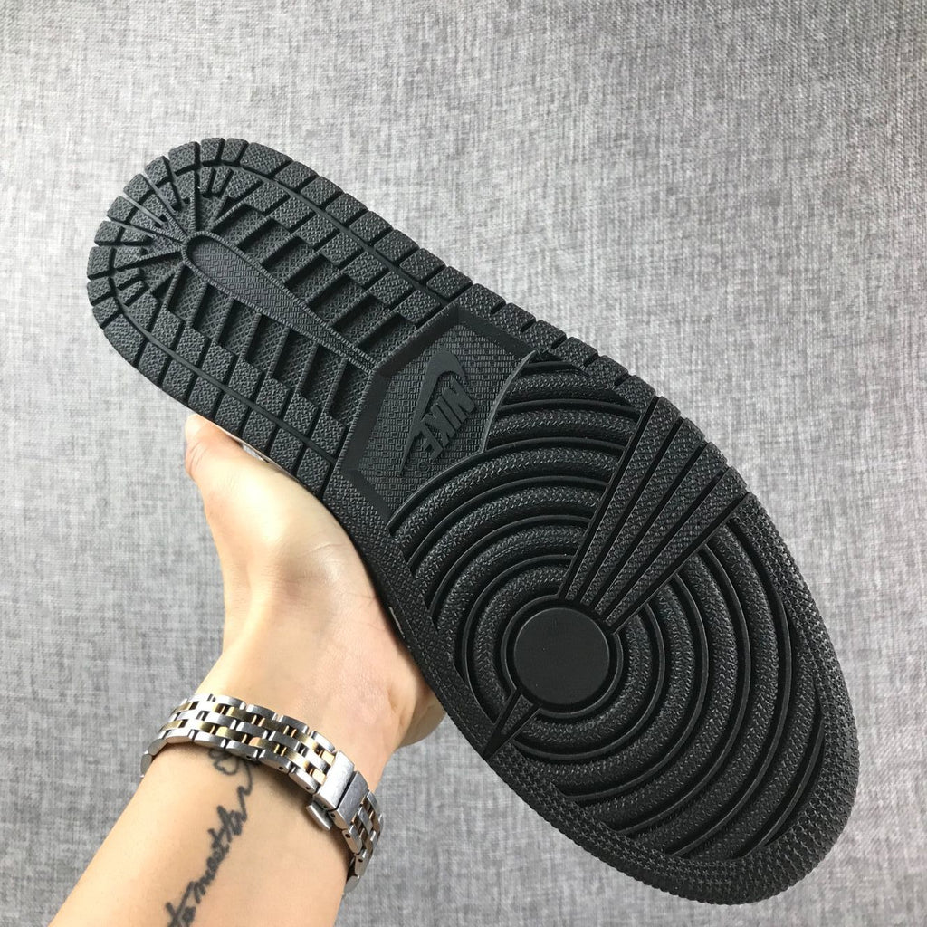 Air Jordan 1 Mid High-Top Sneakers in Grey and Black - product image from the listing.