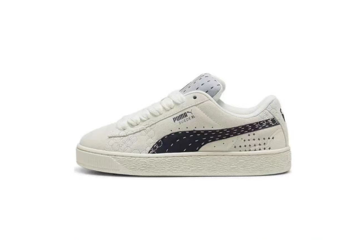 Puma Suede XL Low-Top Sneakers in White and Black - product image from the listing.