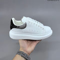 Alexander McQueen Oversized Low-Cut Sneakers with Crystal Heel - product image from the listing.