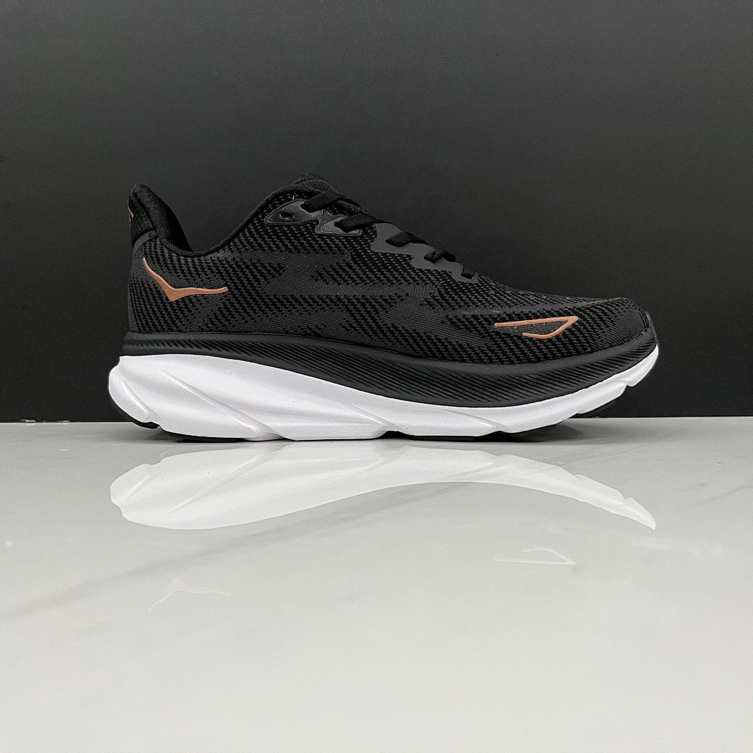 HOKA Clifton 9 Running Shoes in Black and Gold - product image from the listing.