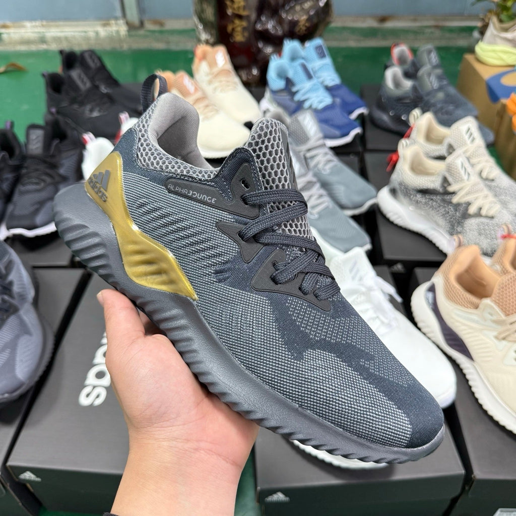 adidas Alphabounce CG4762 Sneakers, in Grey and Gold - product image from the listing.