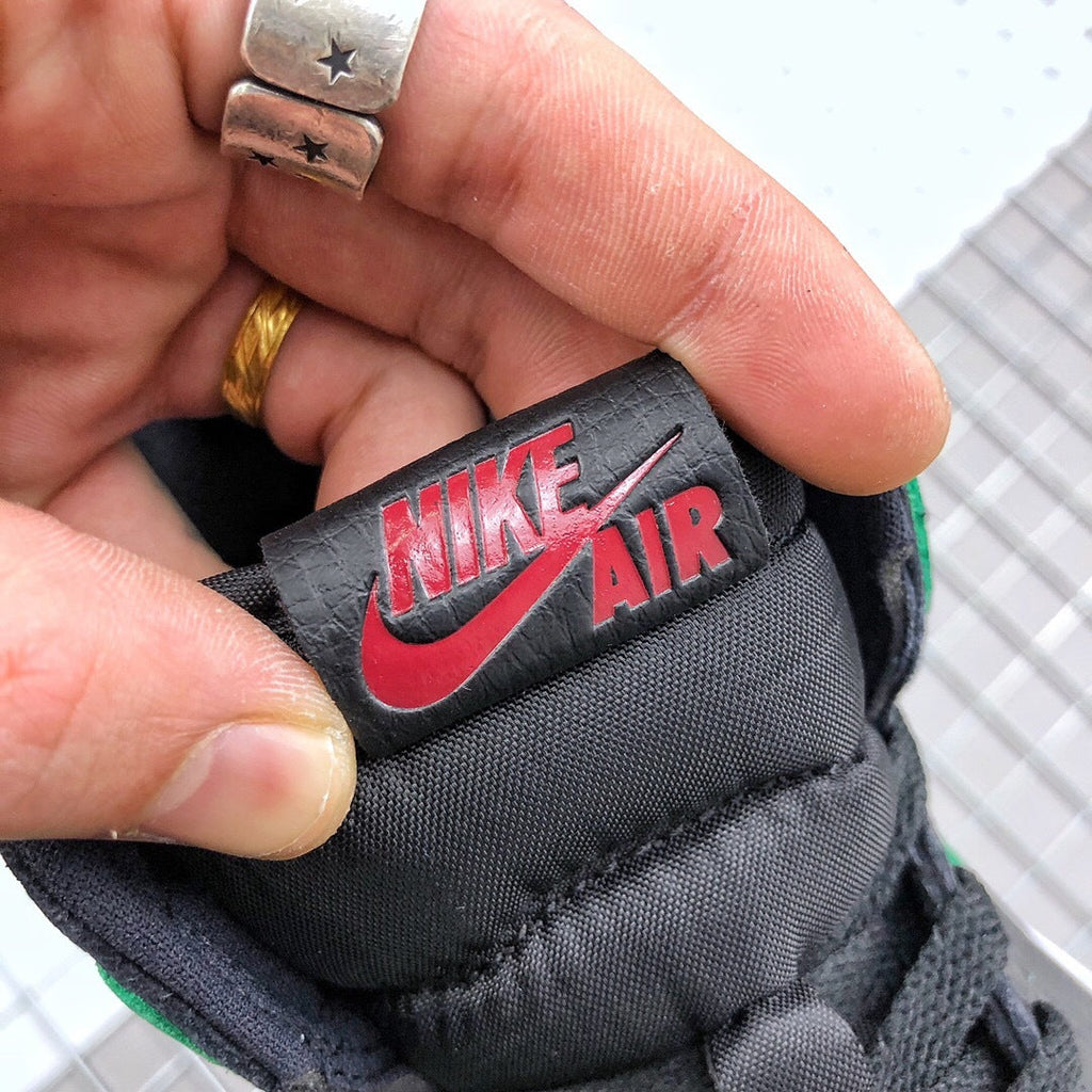 Air Jordan 1 High Pine Sneakers in Green Black 555088-030 - product image from the listing.