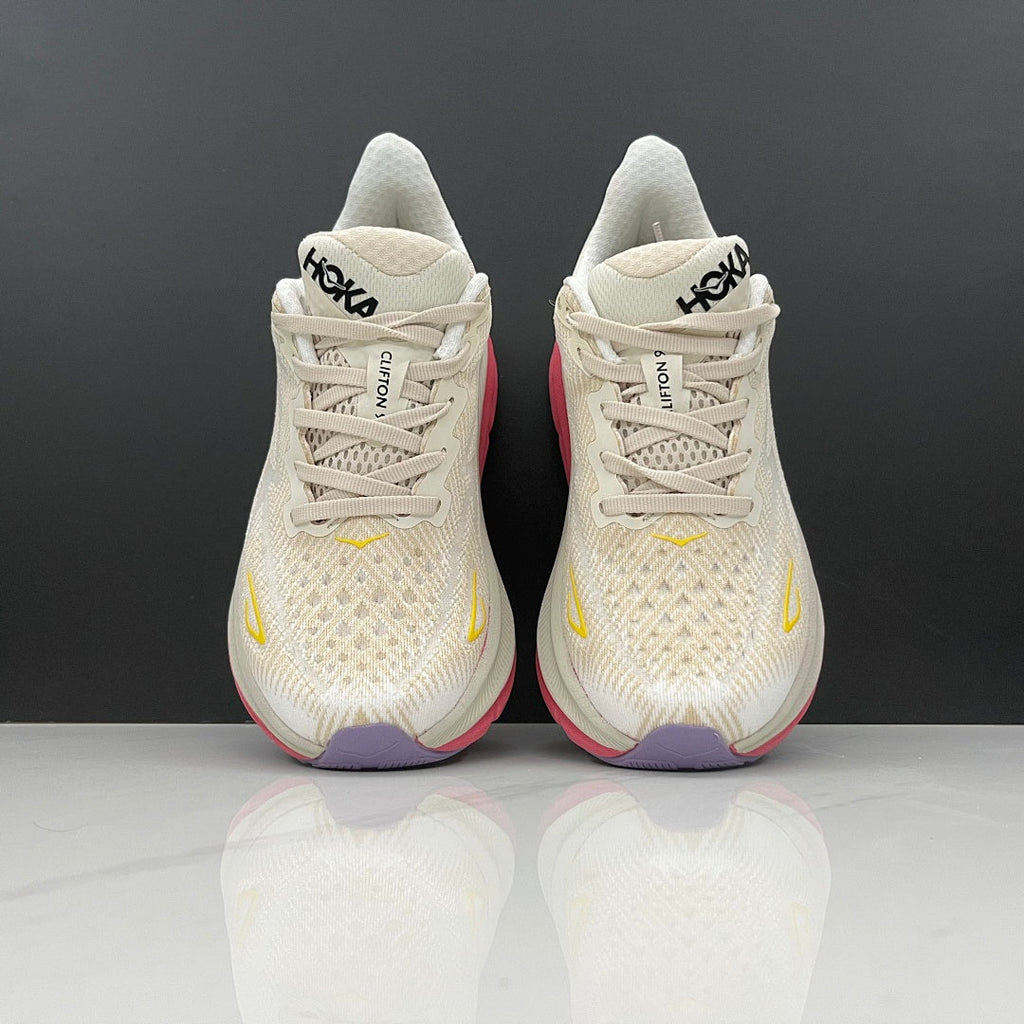 Ivory and Pink HOKA Clifton 9 Running Shoes - product image from the listing.