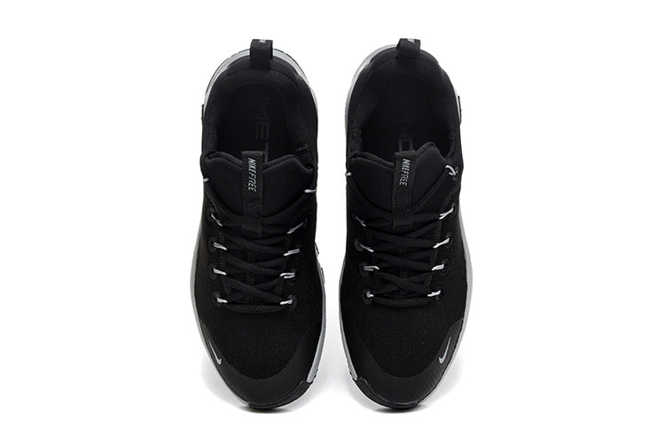 Nike Free Run Low-Top Sneakers in Black and Grey - product image from the listing.