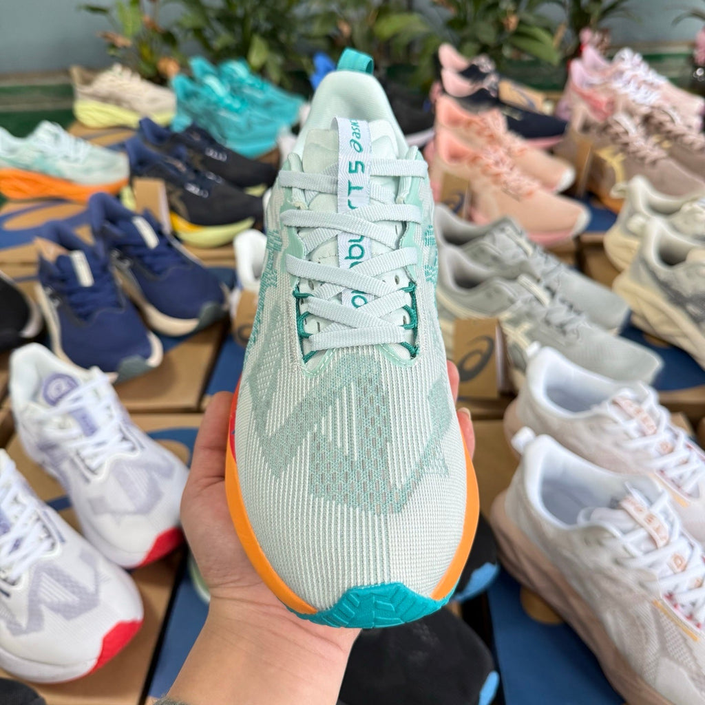 ASICS NOVABLAST 5 LE Running Shoes in White Orange - product image from the listing.
